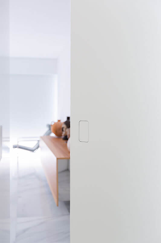 Sistema de apertura puerta pivotante