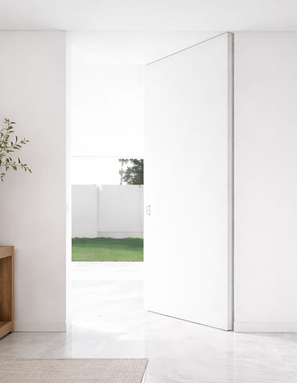 Simulación puerta pivotante a medida integrada en una vivienda